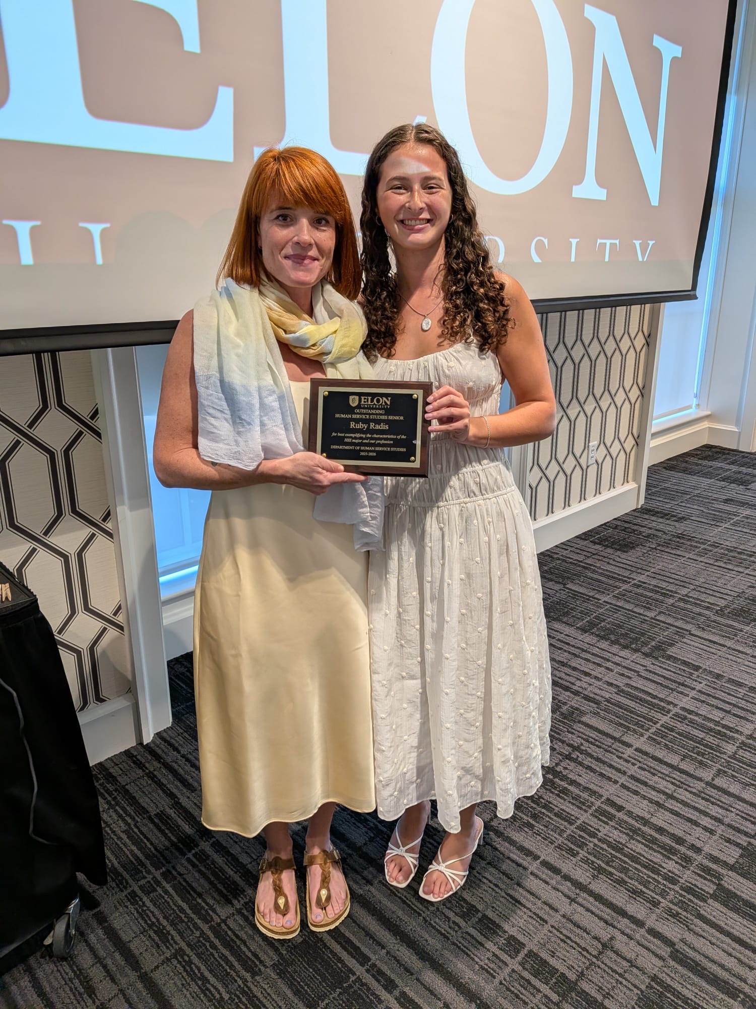 Jessica Navarro with a student at an Elon University awards ceremony